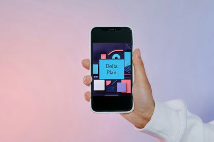 A hand holding a smartphone that displays a colorful app or digital cover titled 'Delta Plan' against a soft pink-to-lavender gradient background.