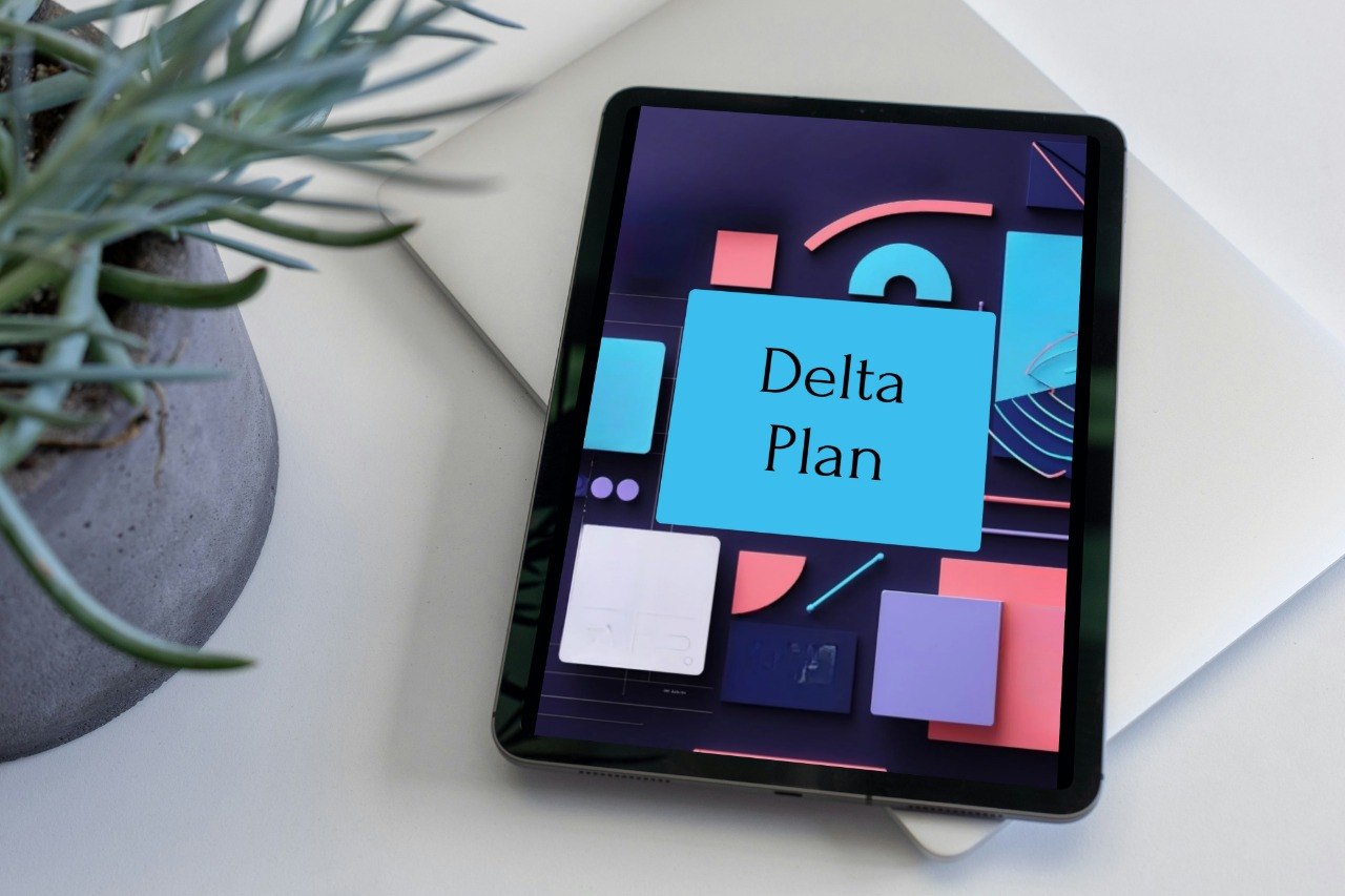 A tablet device lying on a white surface, displaying a colorful digital cover titled 'Delta Plan.' A potted succulent and white envelopes are partially visible around it in a styled setting.
